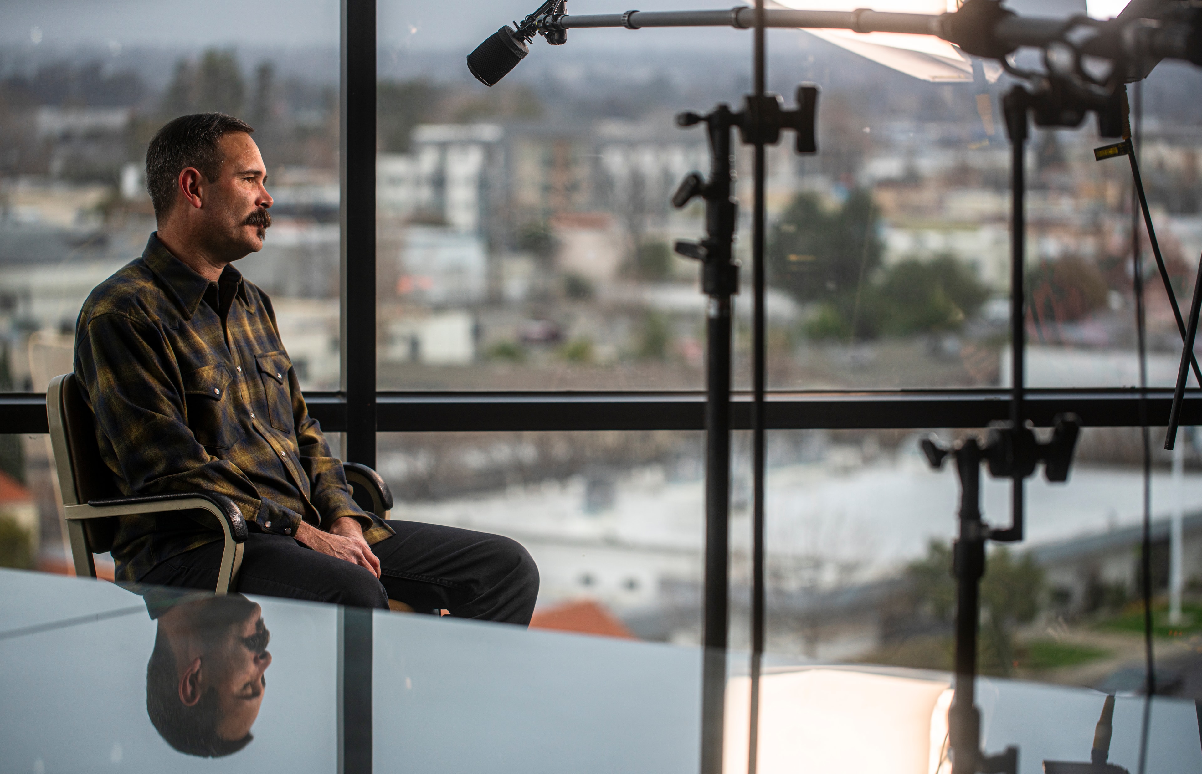 Interview subject — high-rise window, Kern Oil