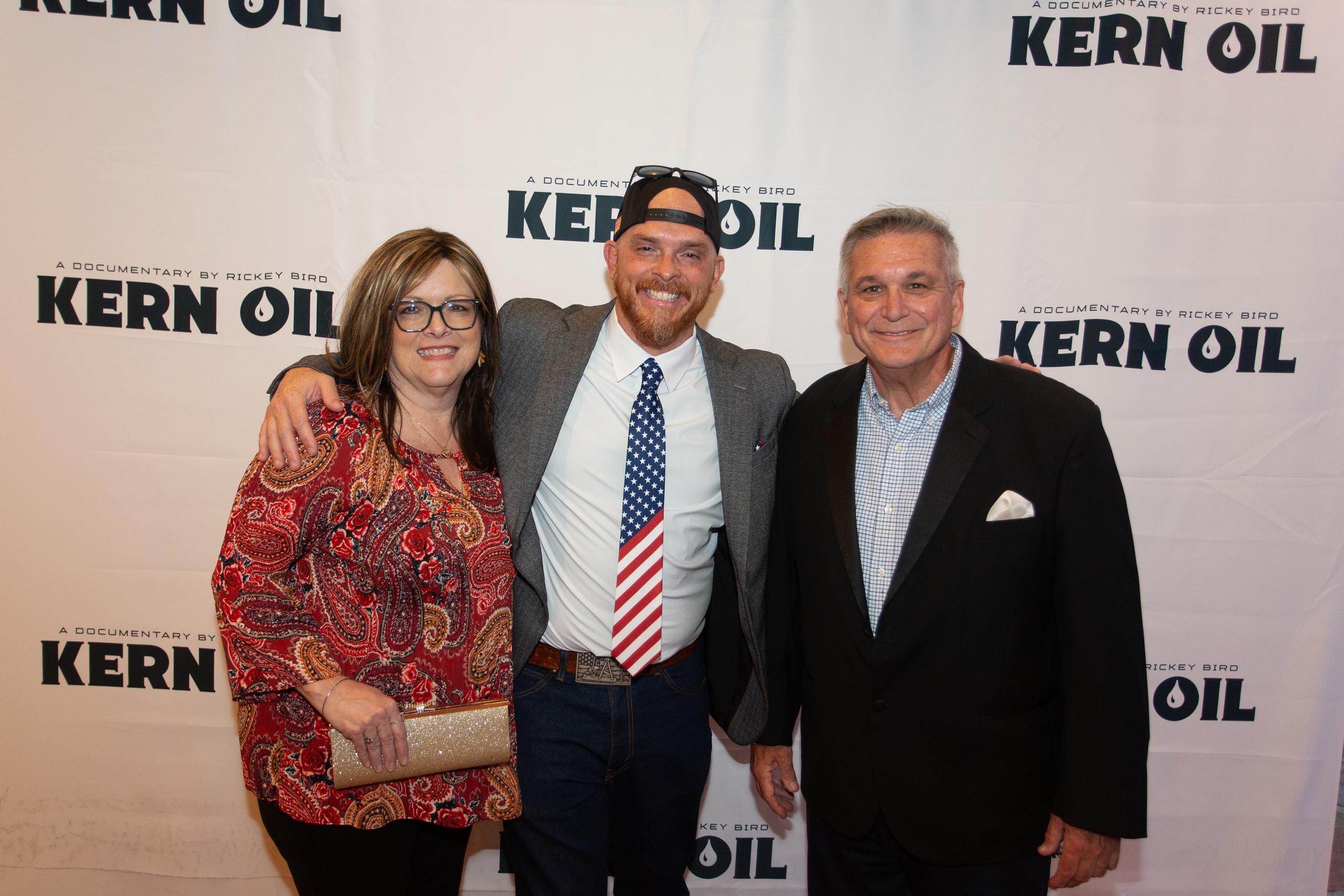 Three people posing at Kern Oil documentary premiere