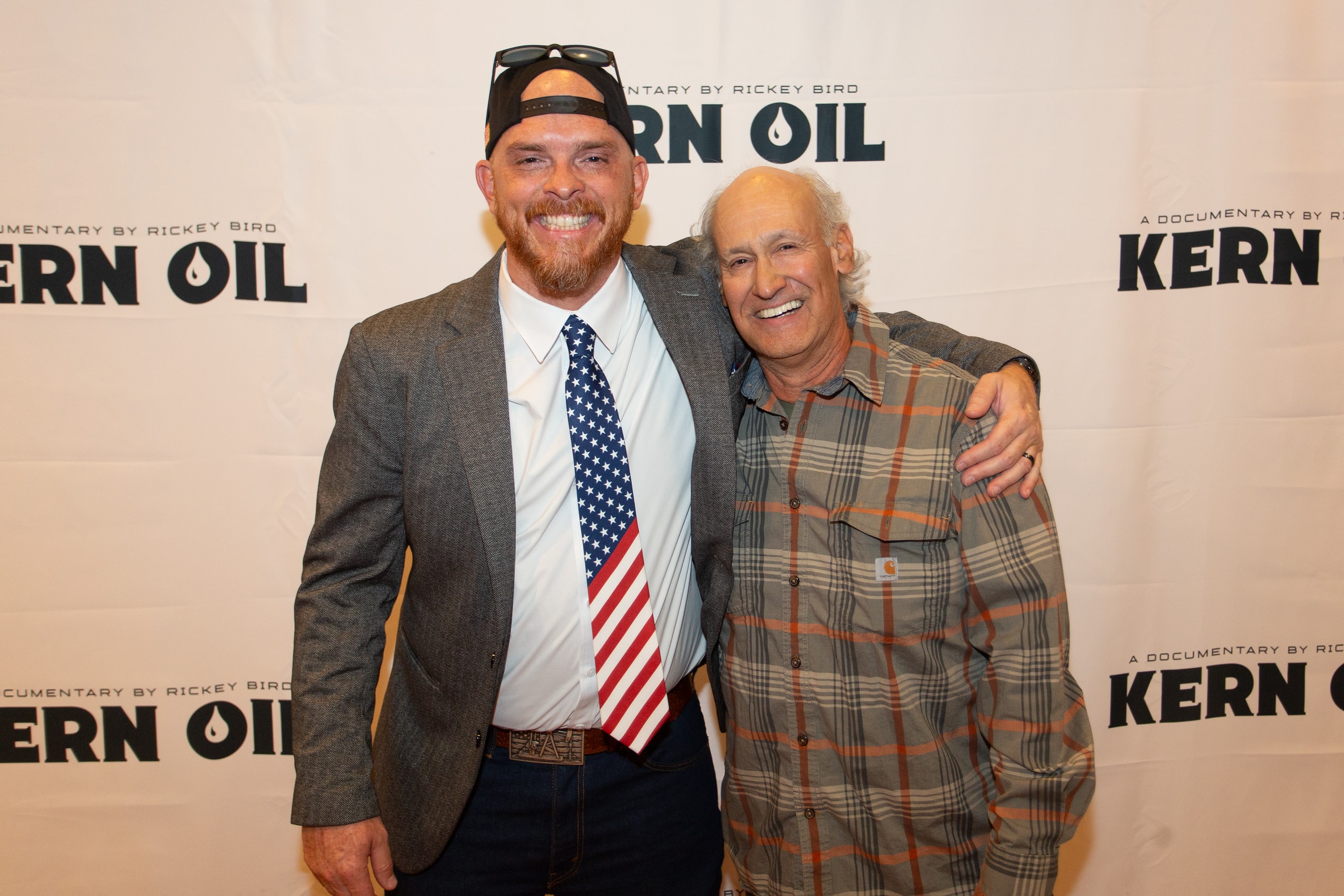 Two men posing at Kern Oil documentary premiere