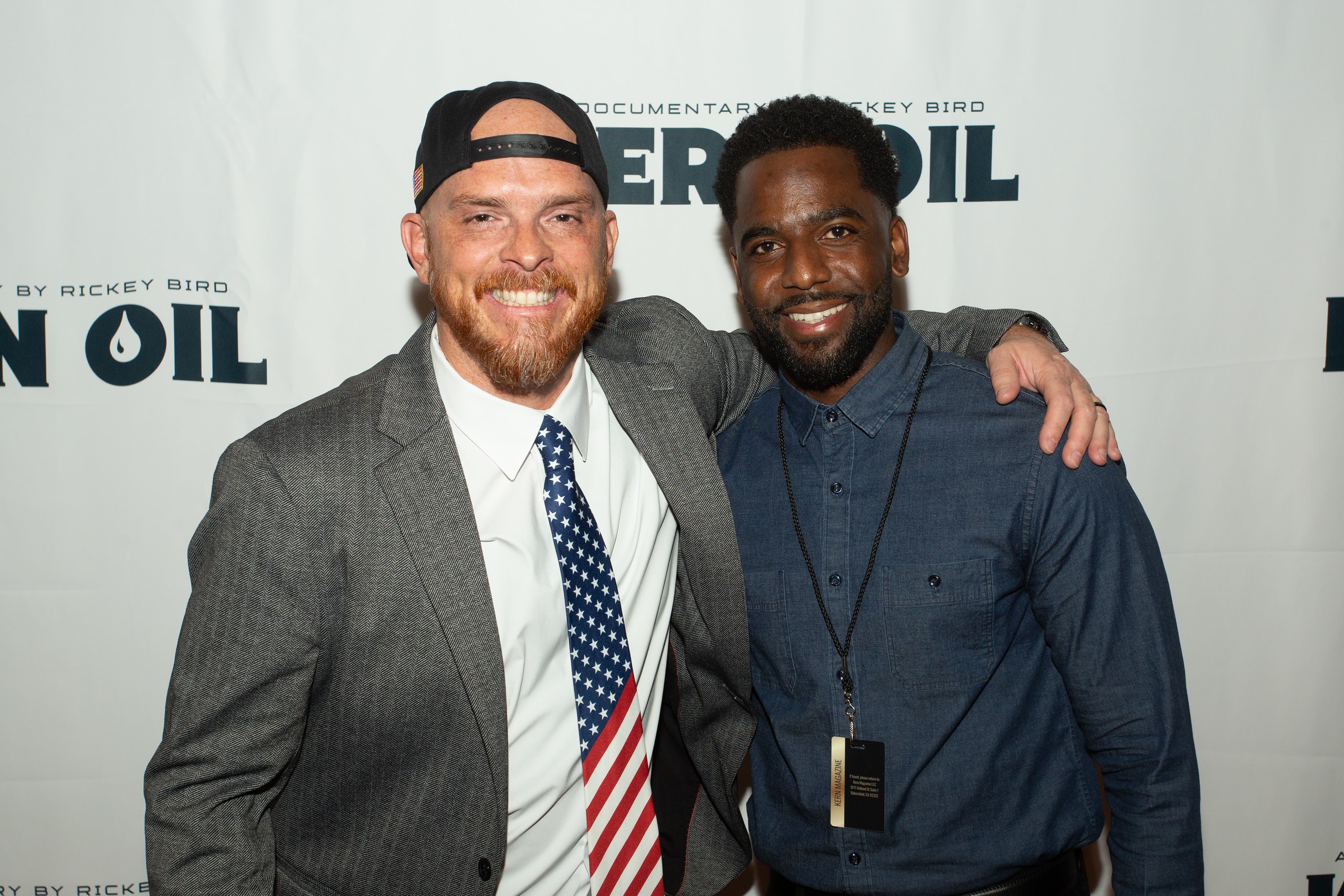 Two men posing at Kern Oil documentary premiere