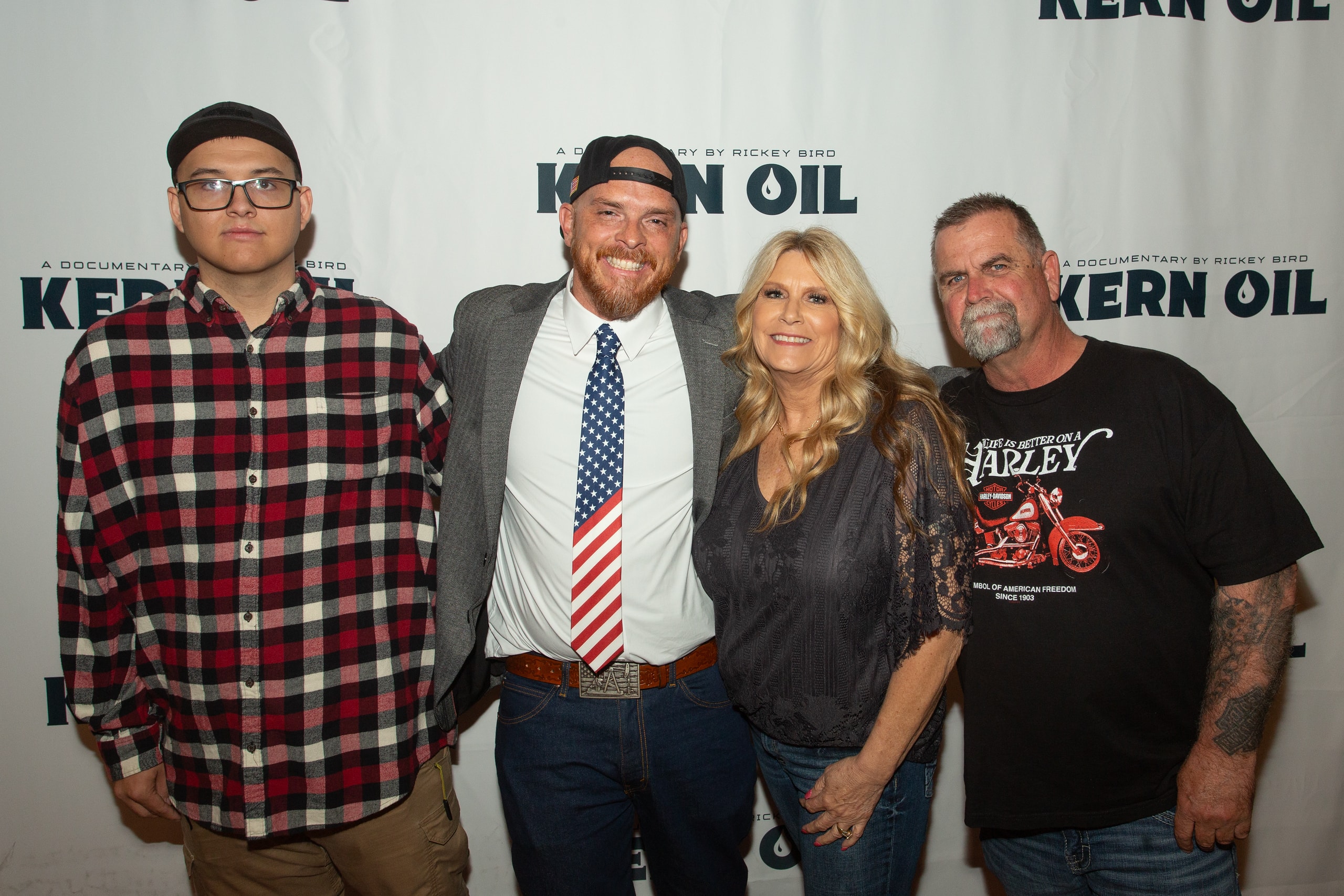 Four people posing at Kern Oil documentary premiere