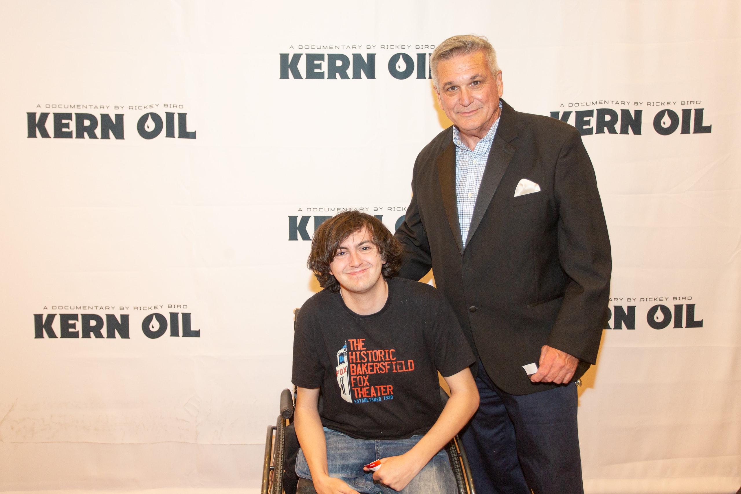 Man and boy at Kern Oil documentary premiere