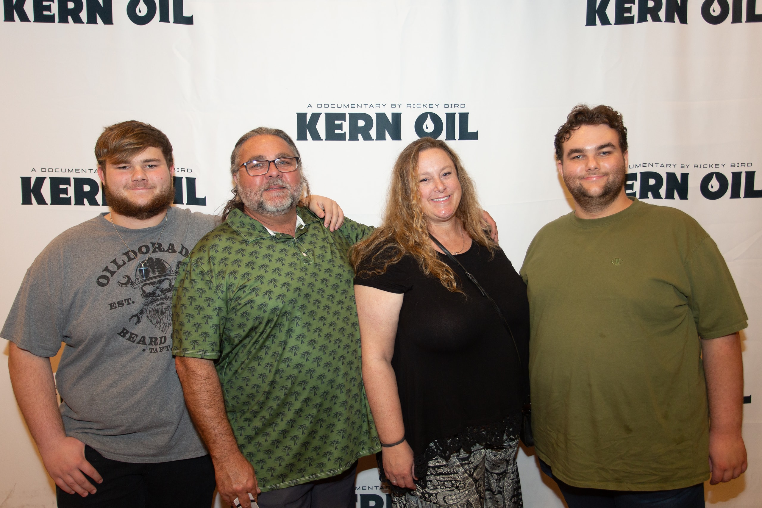 Four people posing at Kern Oil documentary premiere
