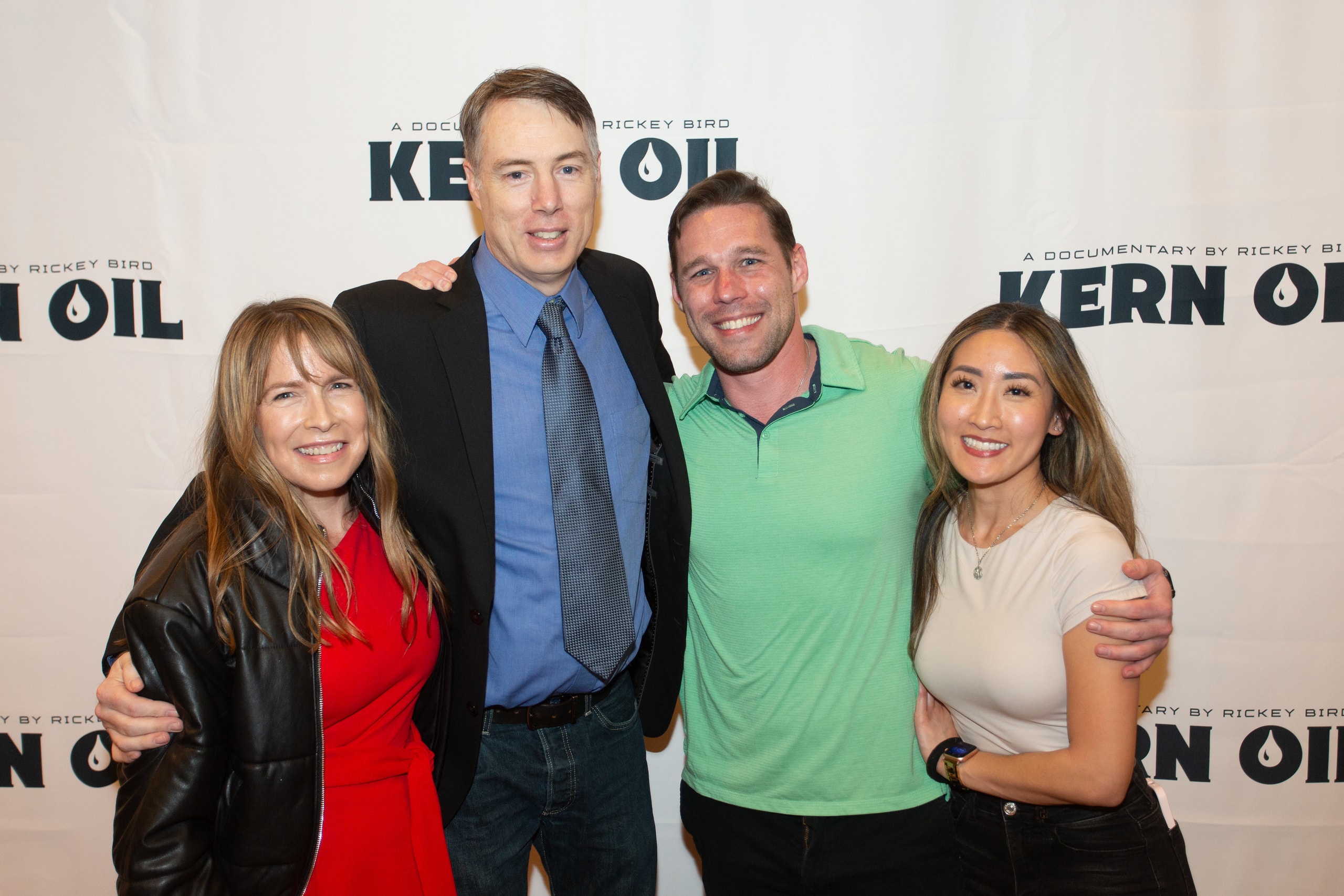 Four people posing at Kern Oil documentary premiere