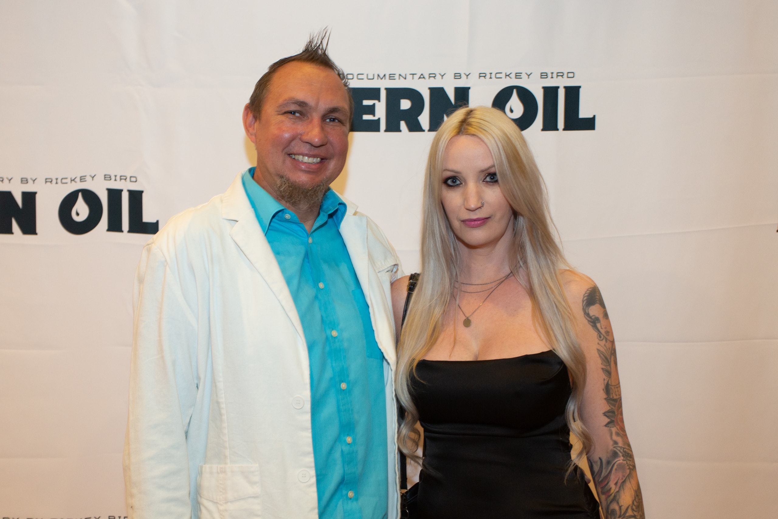 Two people at Kern Oil documentary premiere