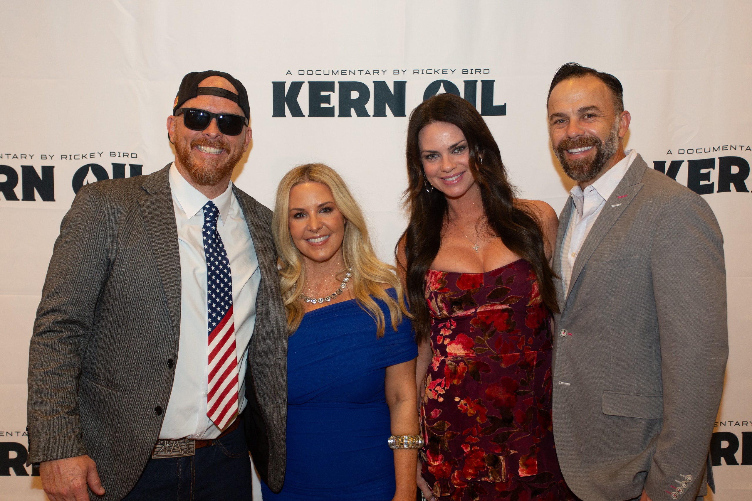 Four people posing at Kern Oil documentary premiere