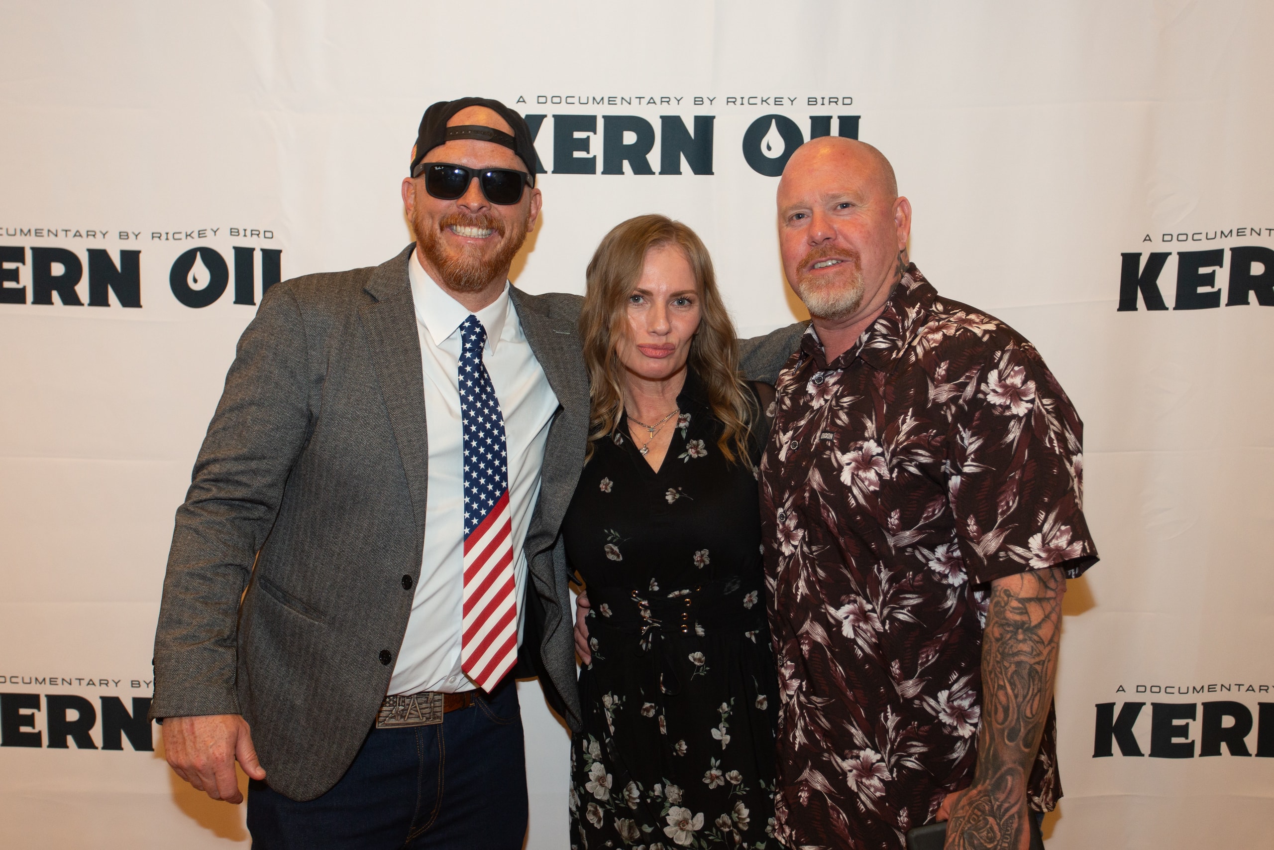Three people posing at Kern Oil documentary premiere