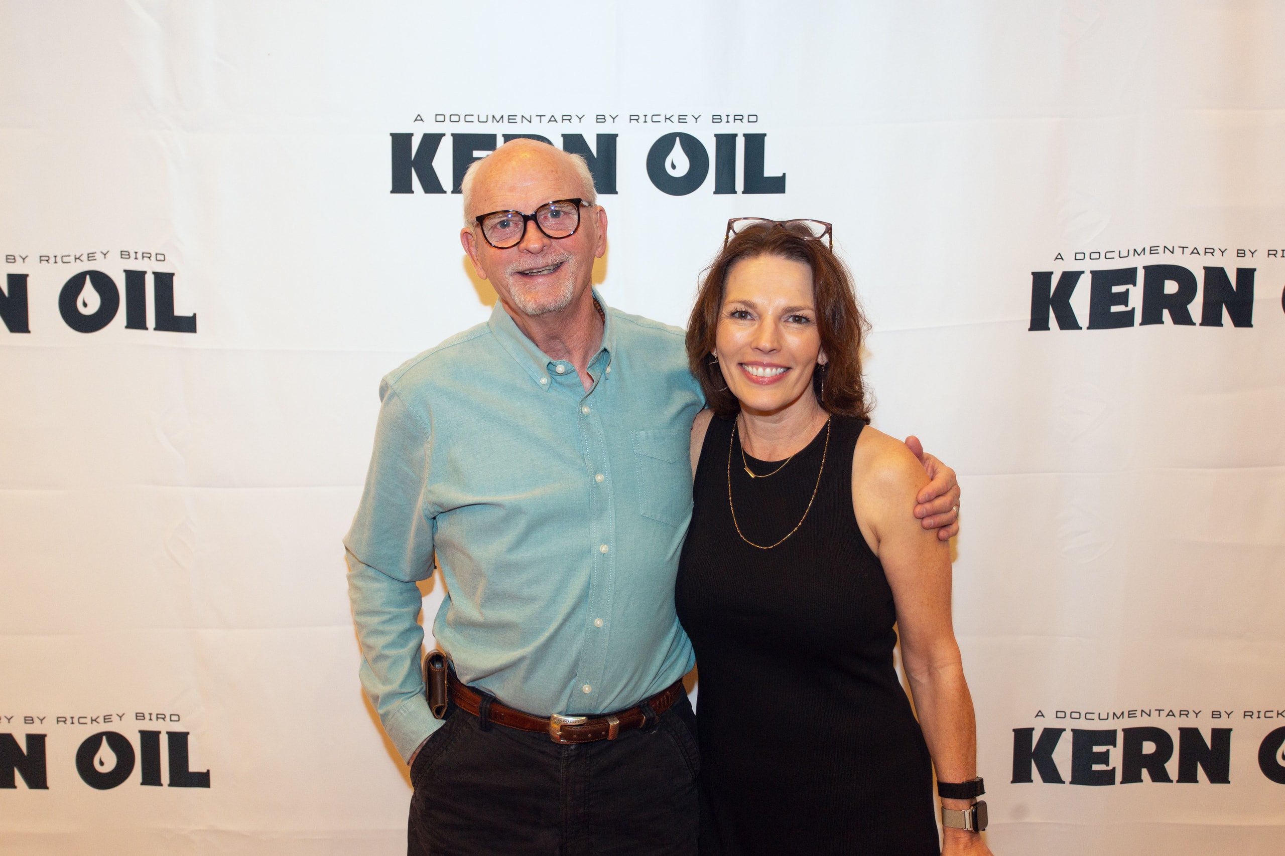 Two people posing at Kern Oil documentary premiere