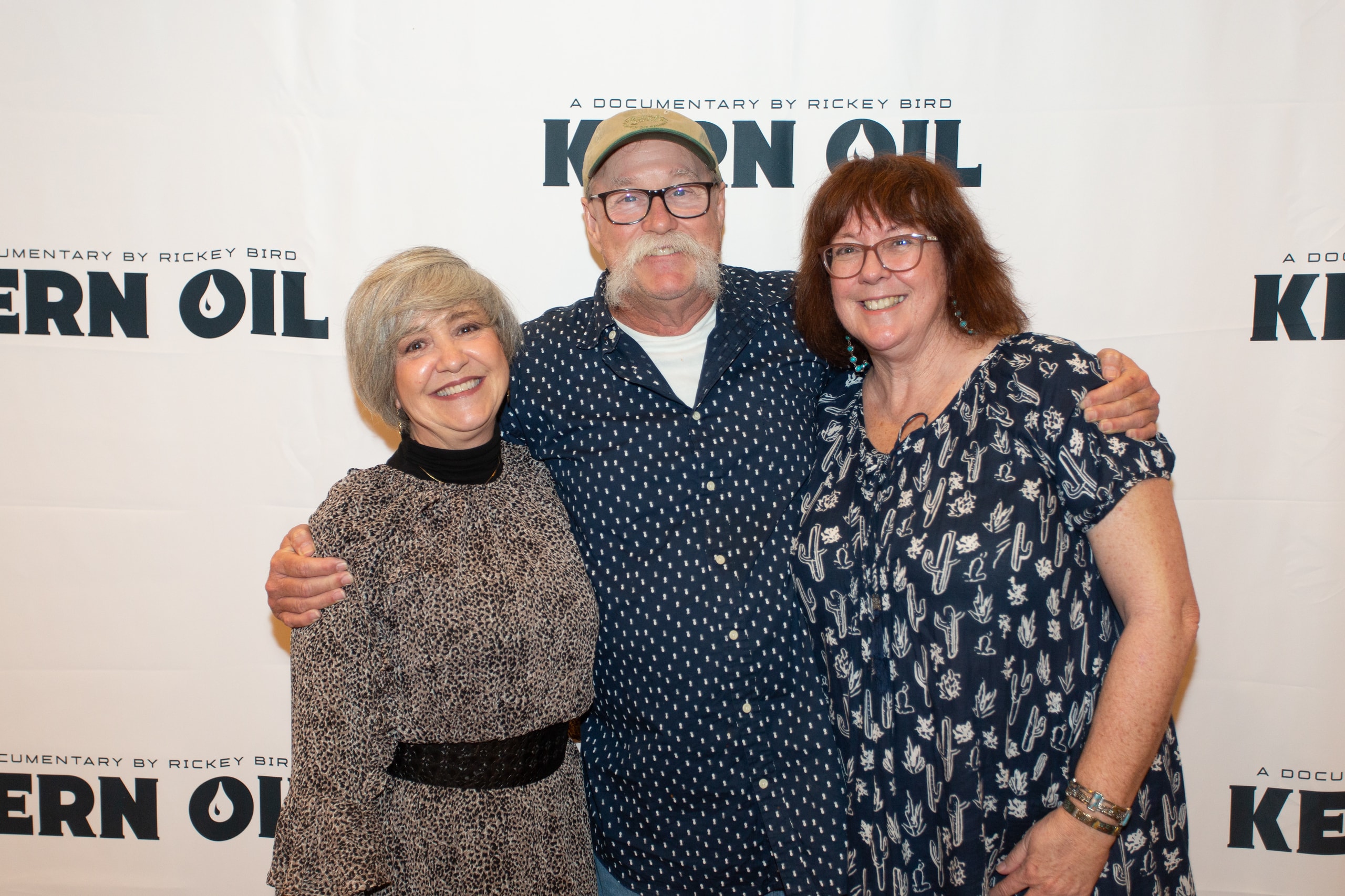 Three people posing at Kern Oil documentary premiere
