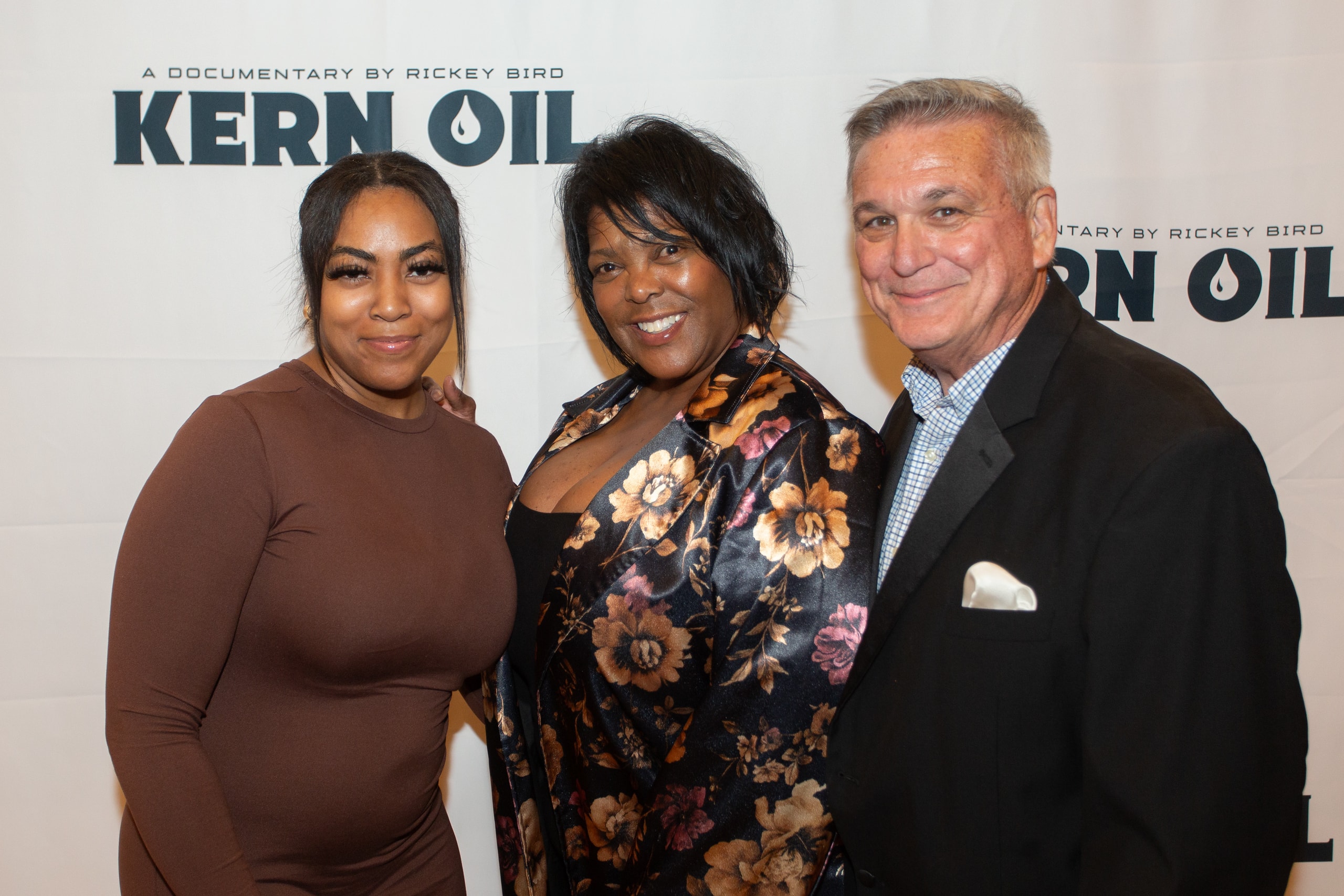 Three people posing at Kern Oil documentary premiere