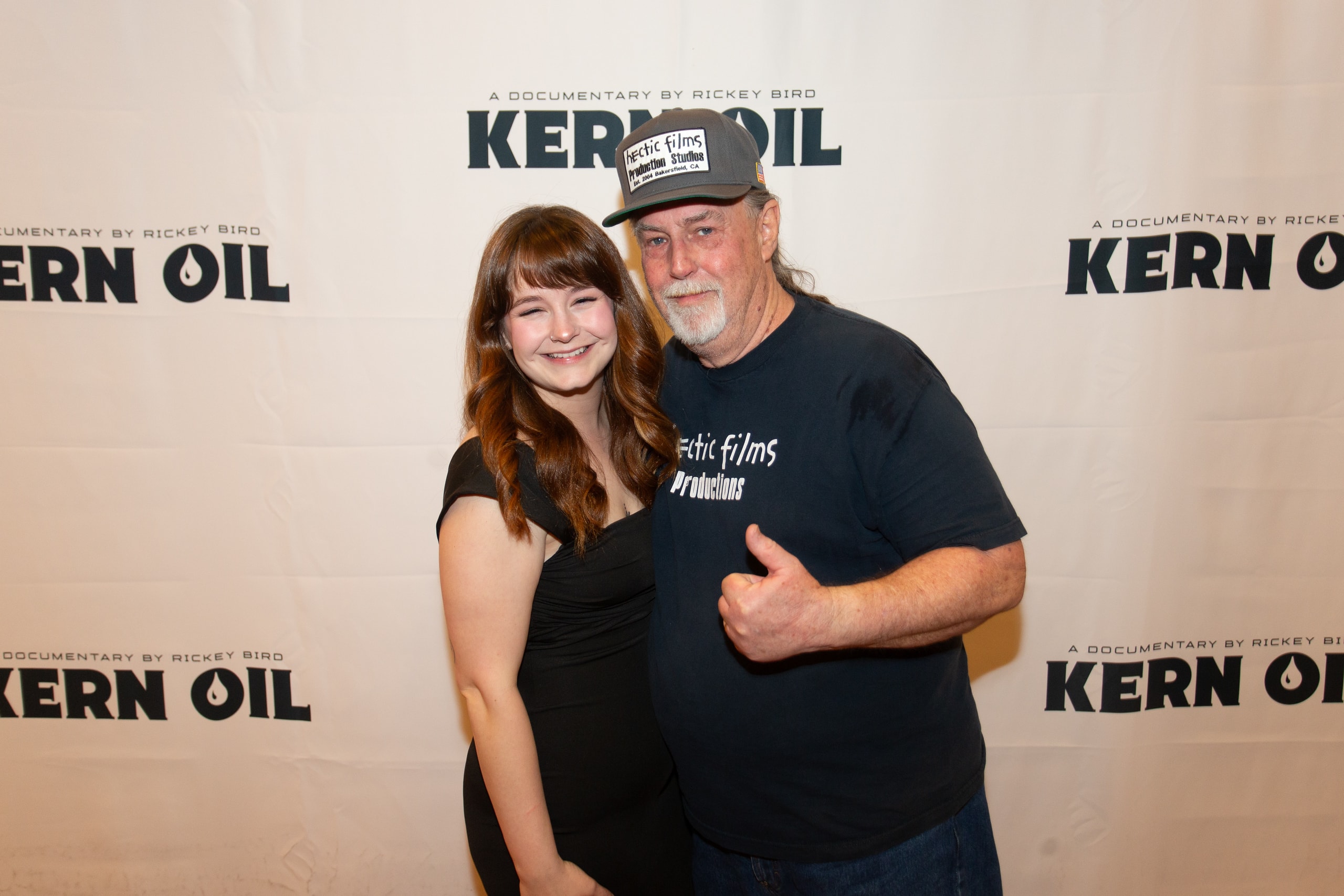 Two people posing at Kern Oil documentary premiere