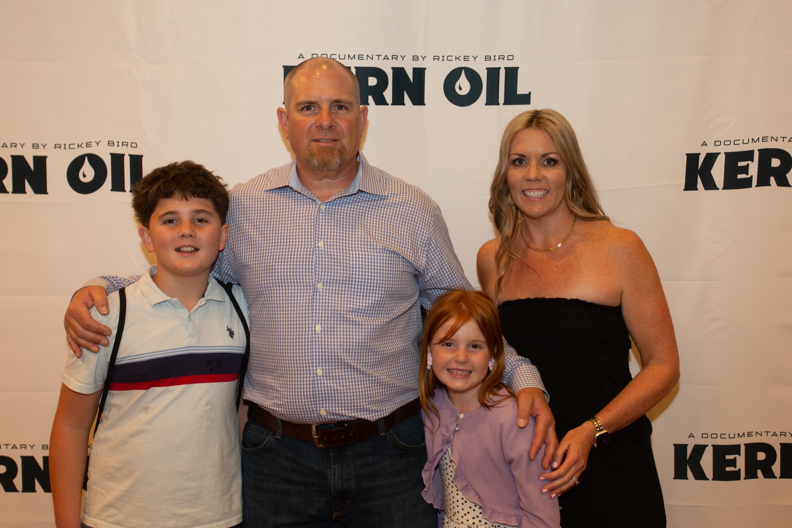Family posing at Kern Oil documentary premiere