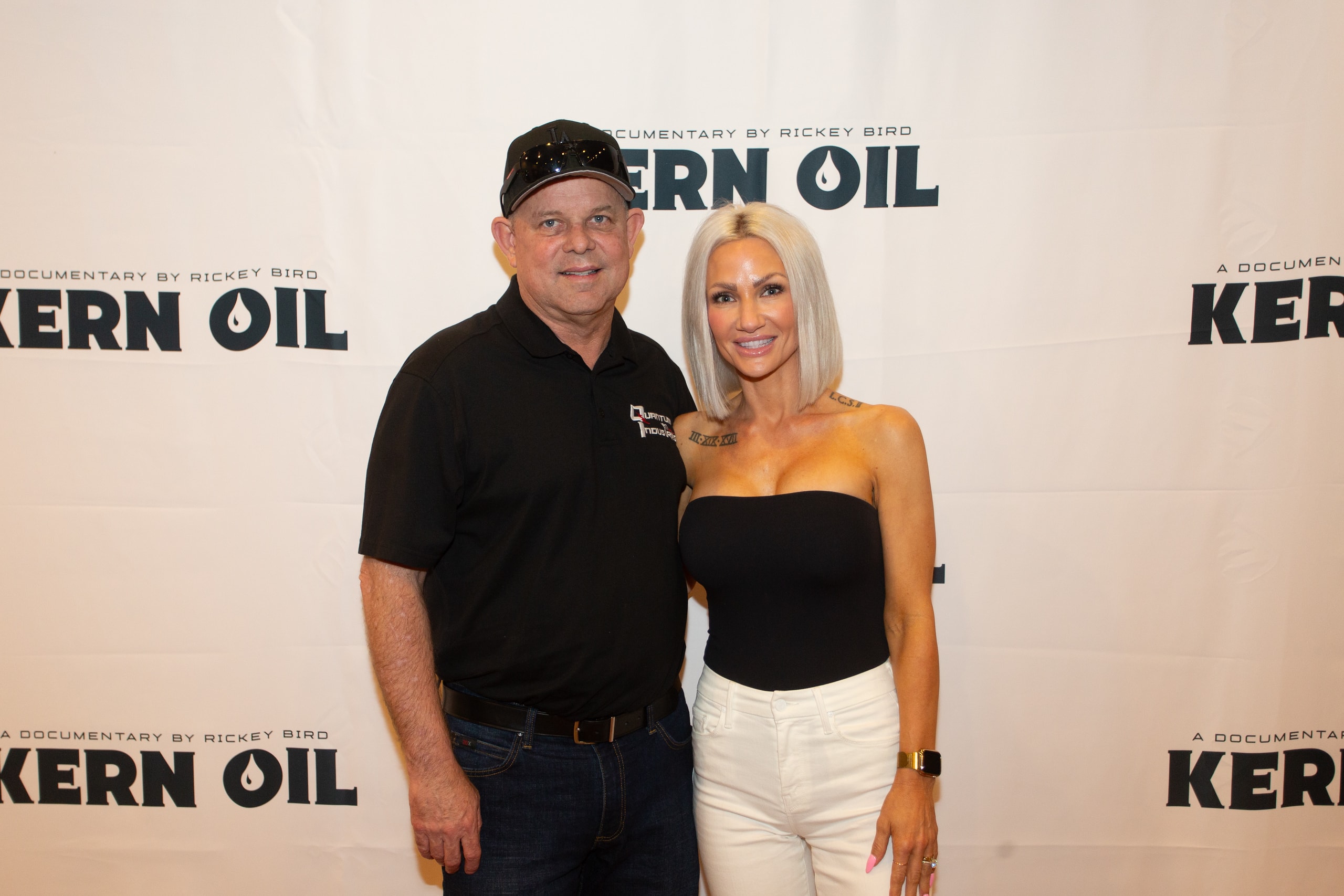 Two people posing at Kern Oil documentary premiere