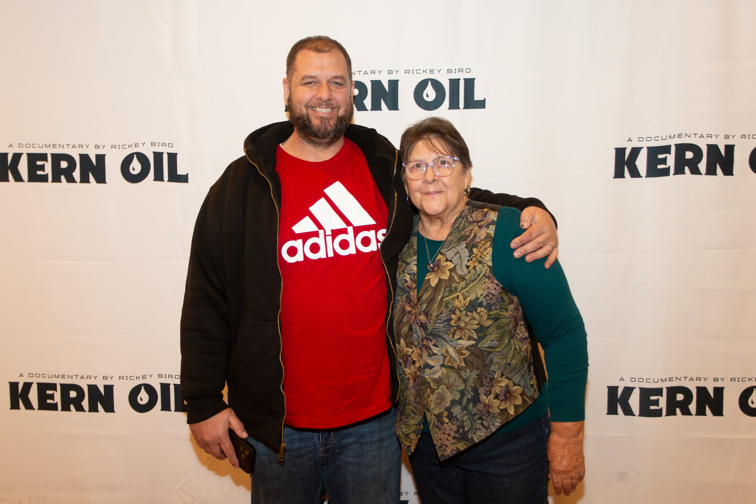 Two people posing at Kern Oil documentary premiere