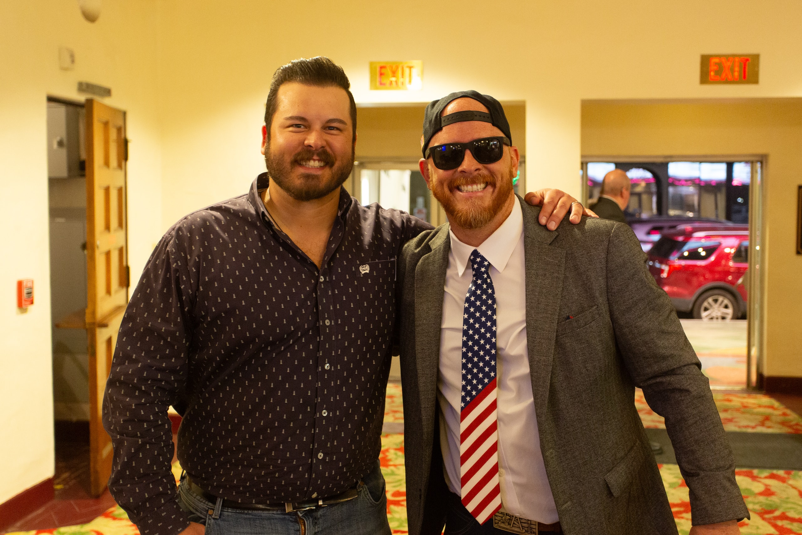 Two men posing together at Kern Oil premiere