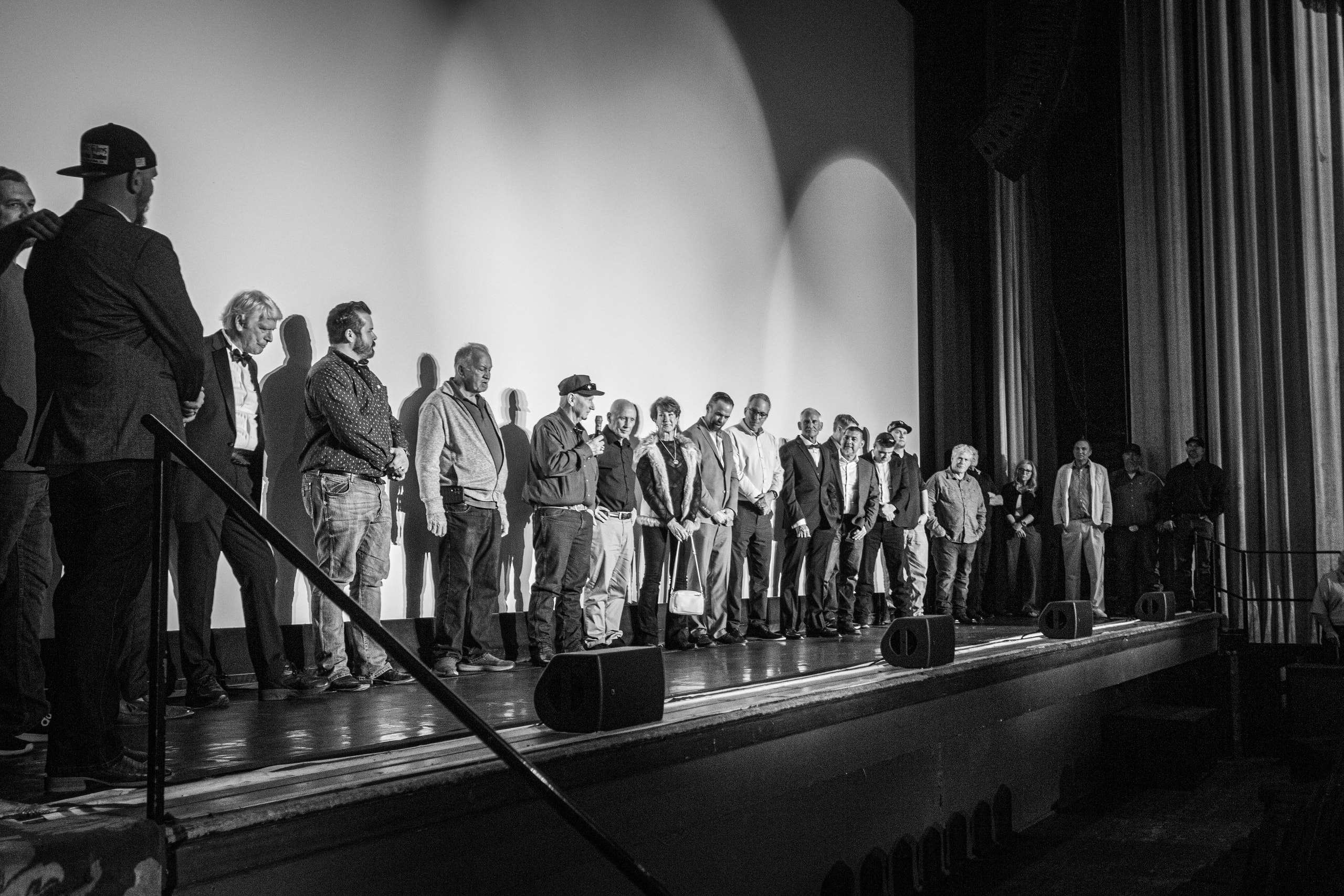 Group standing on stage at Kern Oil premiere