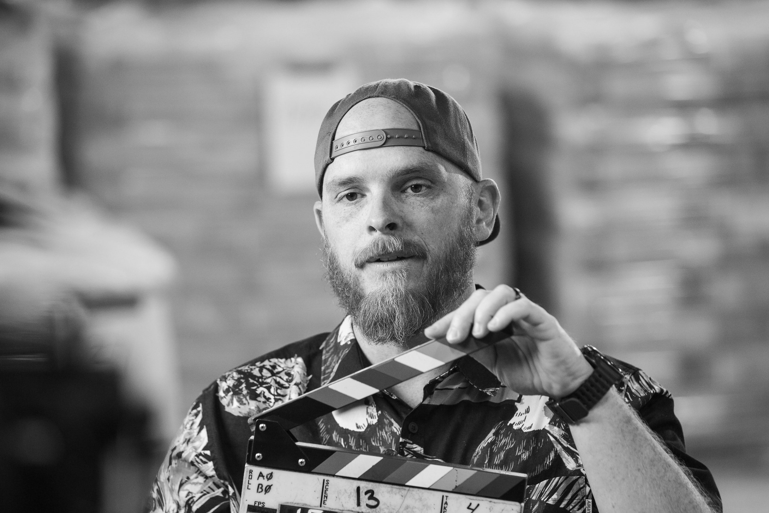 Rickey Bird with clapperboard — Kern Oil
